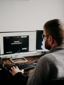 designer at computer working on building a construction website
